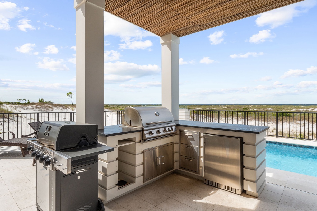 Picture yourself grilling fresh catch under a shaded pergola, with expansive coastal views stretching before you and a sparkling pool just steps away—your perfect outdoor kitchen awaits.