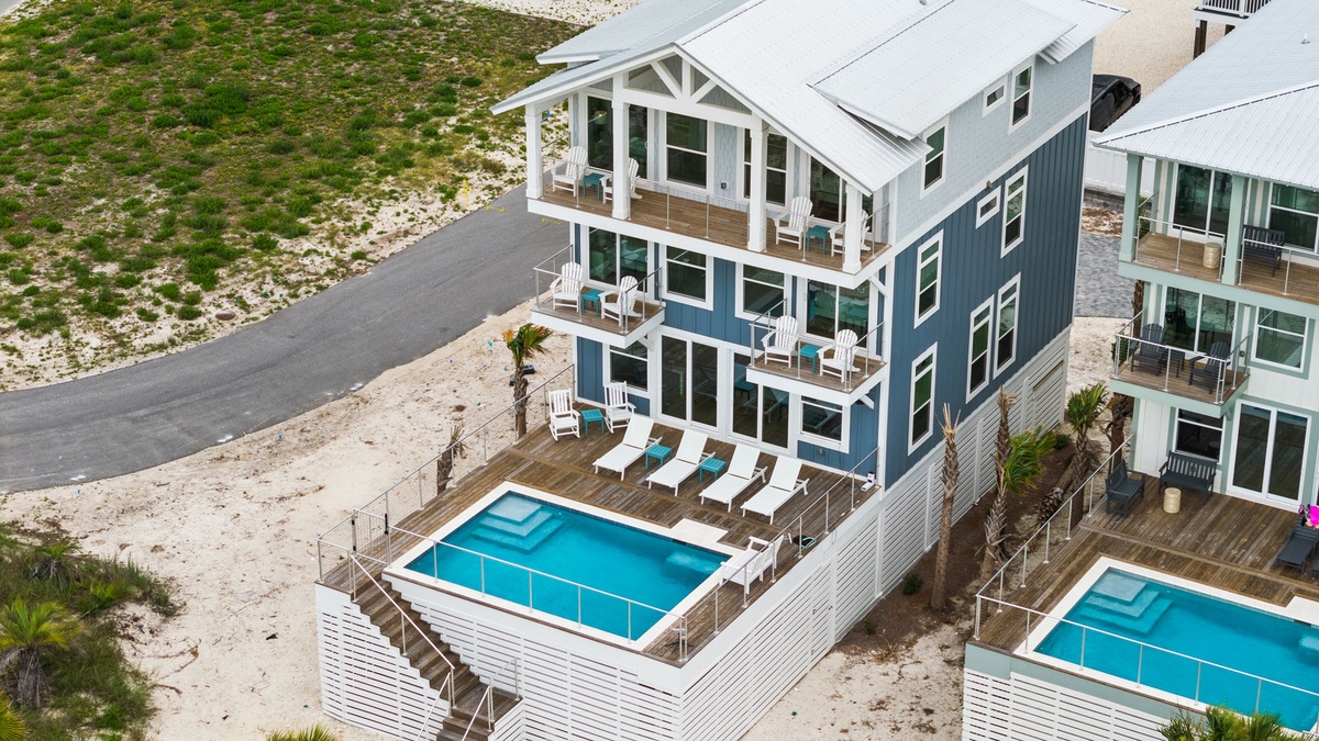 This coastal retreat features a private pool and spacious balconies overlooking the area, perfect for soaking up the sun and enjoying the beach lifestyle.