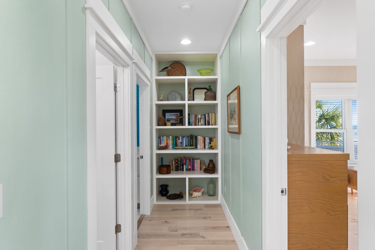 Discover your quiet reading nook with built-in bookshelves and curated collection, perfect for unwinding between adventures.