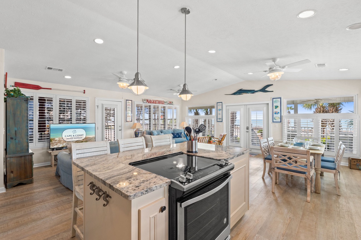 Your open kitchen flows seamlessly into the living area, where coastal charm meets modern comfort for memorable family meals.