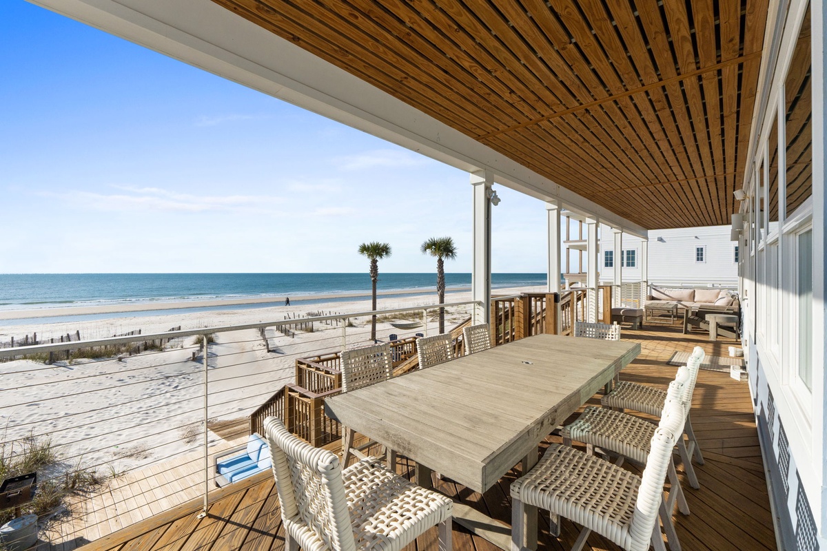 Your private oceanfront deck offers spectacular sea views with dining space just steps from pristine sand.