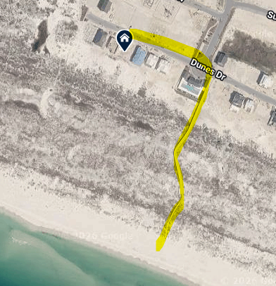 Aerial view of property beach access via community boardwalk.