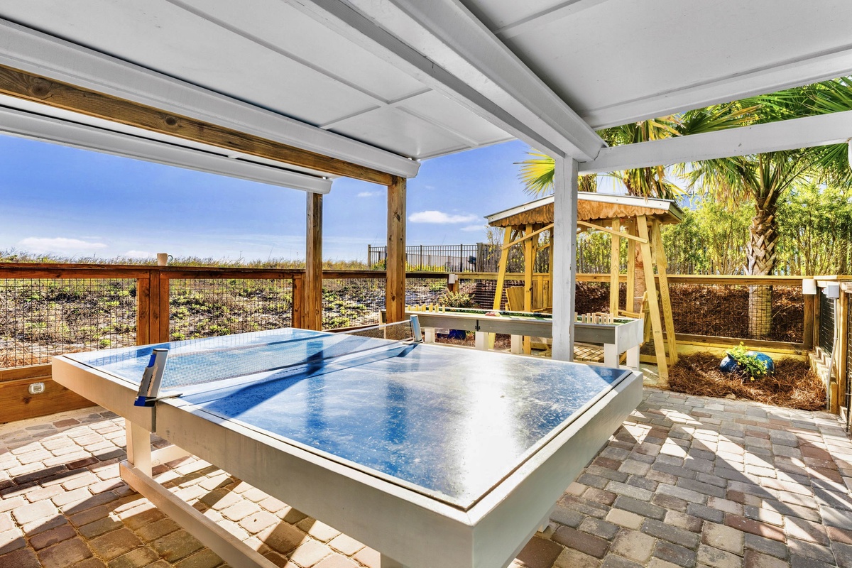 Enjoy a game of ping pong, while tropical breezes whisper through the palms around you.