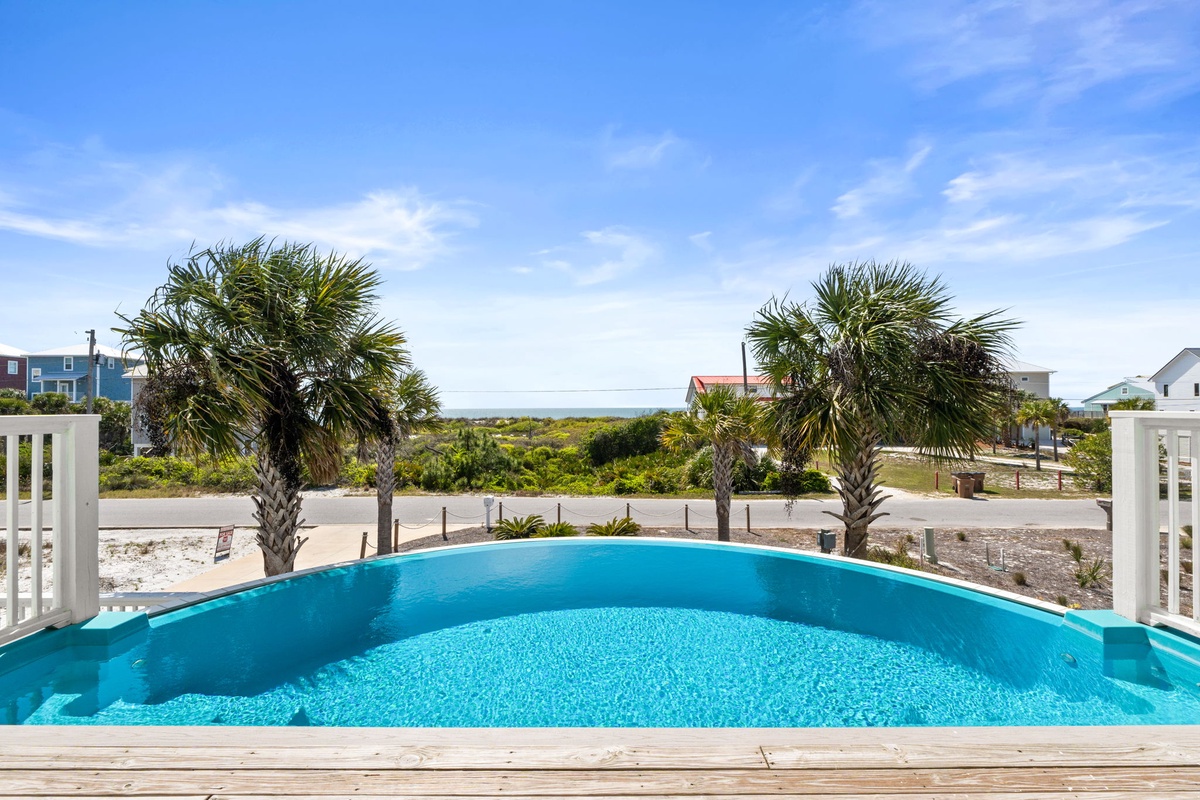 Take a refreshing dip in your private pool while soaking up stunning ocean views framed by swaying palm trees.