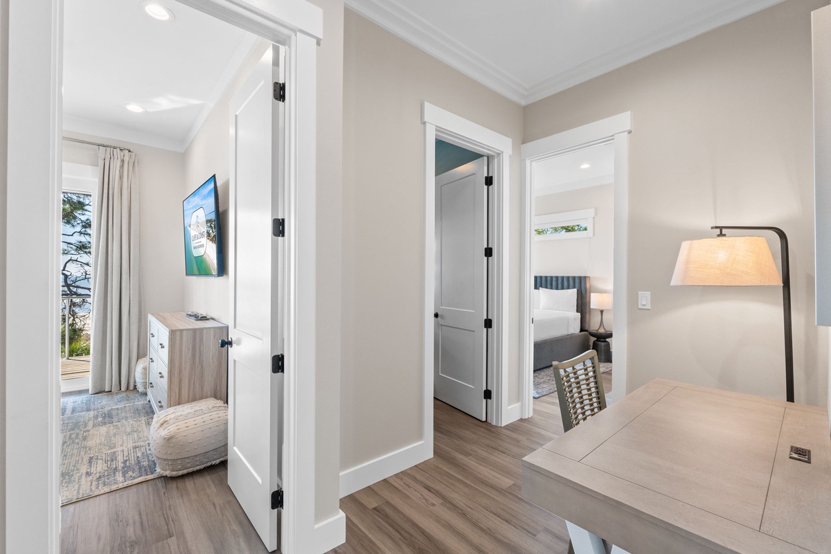 Your private workspace features warm lighting and connects to cozy bedrooms, perfect for mixing productivity with relaxation during your stay.