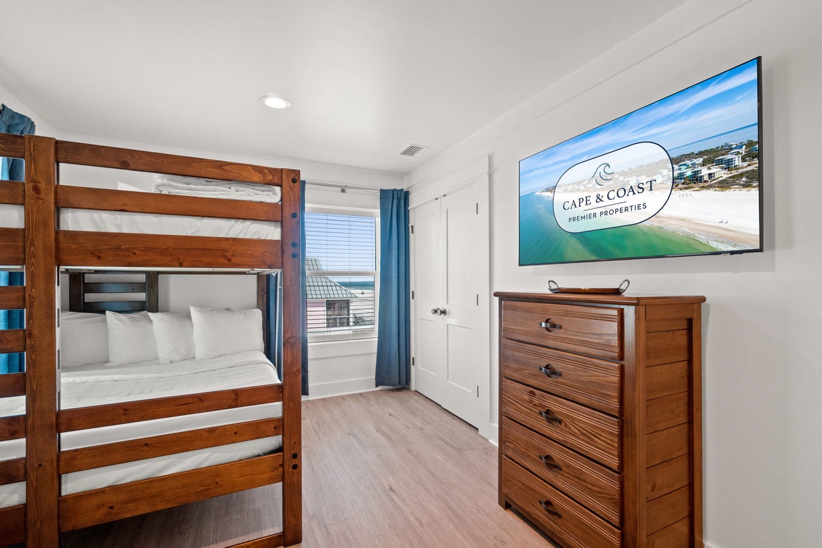 Your coastal getaway features comfortable bunk beds and warm wood furnishings, perfect for family adventures by the sea.