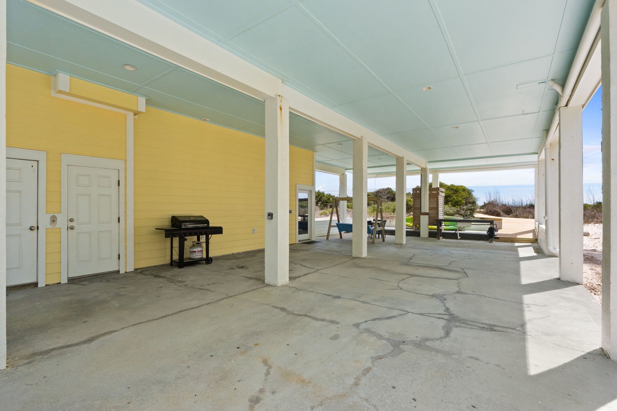 Your covered patio offers shade and space to grill, with BBQ facilities ready for outdoor cooking adventures.