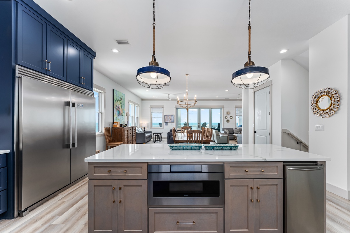 Your gourmet kitchen features stainless steel appliances and stylish pendant lights, perfect for creating memorable meals.