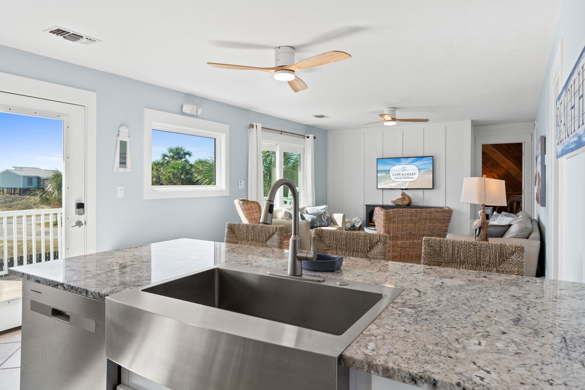 The oversized kitchen island anchors the open living space, making it easy to cook, serve, and stay connected.