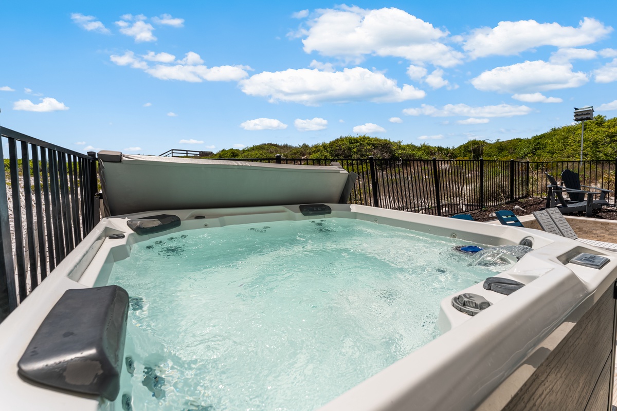Soak away your worries in this bubbling hot tub, where warm jets and peaceful views create your perfect relaxation retreat.
