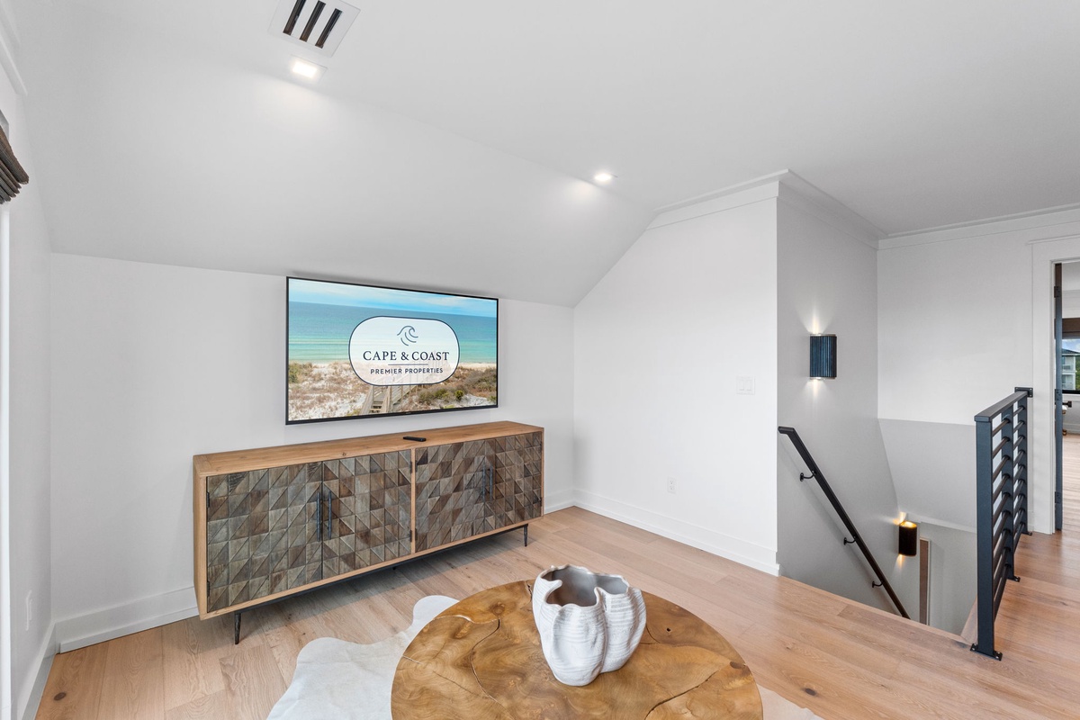 Relax in your private upstairs lounge with ocean-view décor, stylish furnishings, and a cozy seating area perfect for unwinding after a day at the beach.
