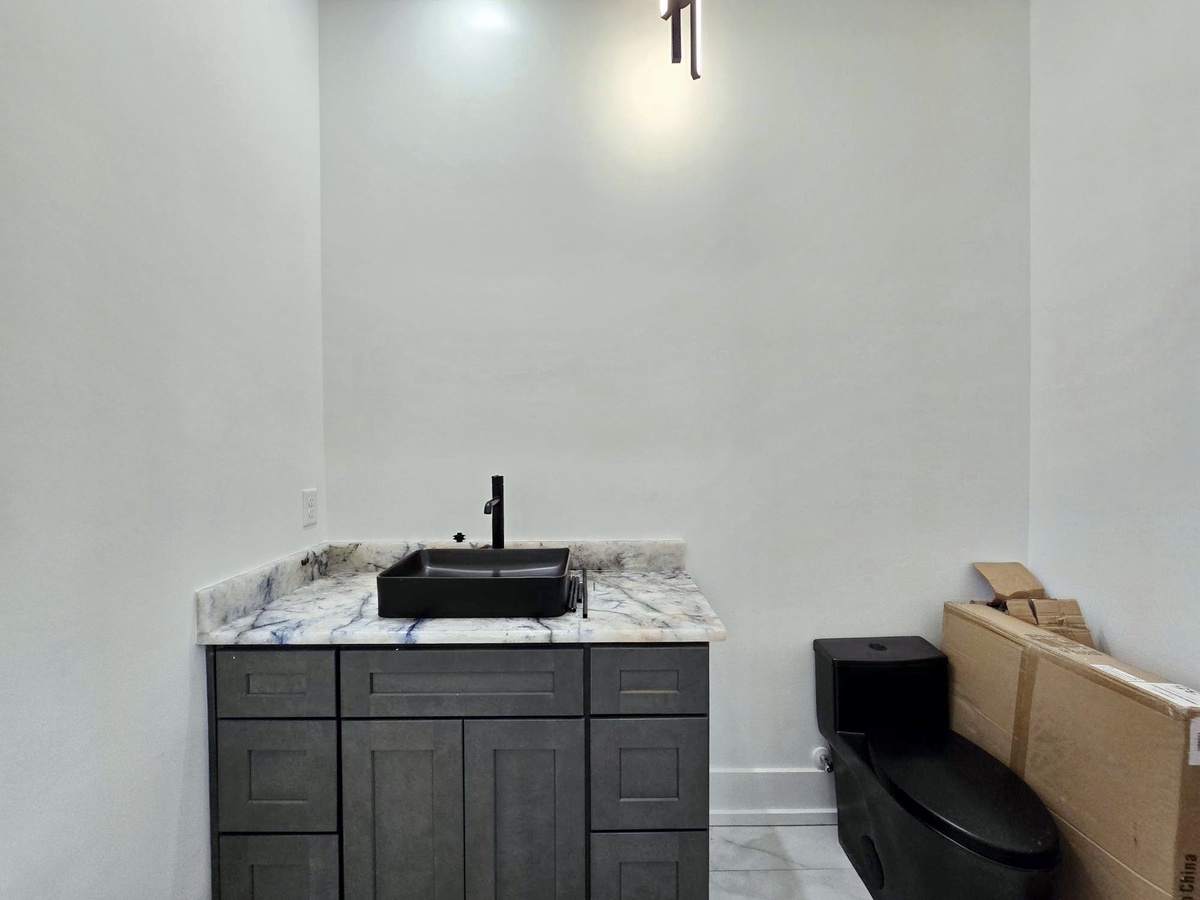 Your private bathroom features sleek marble countertops and modern fixtures, creating a spa-like retreat for your daily routines.