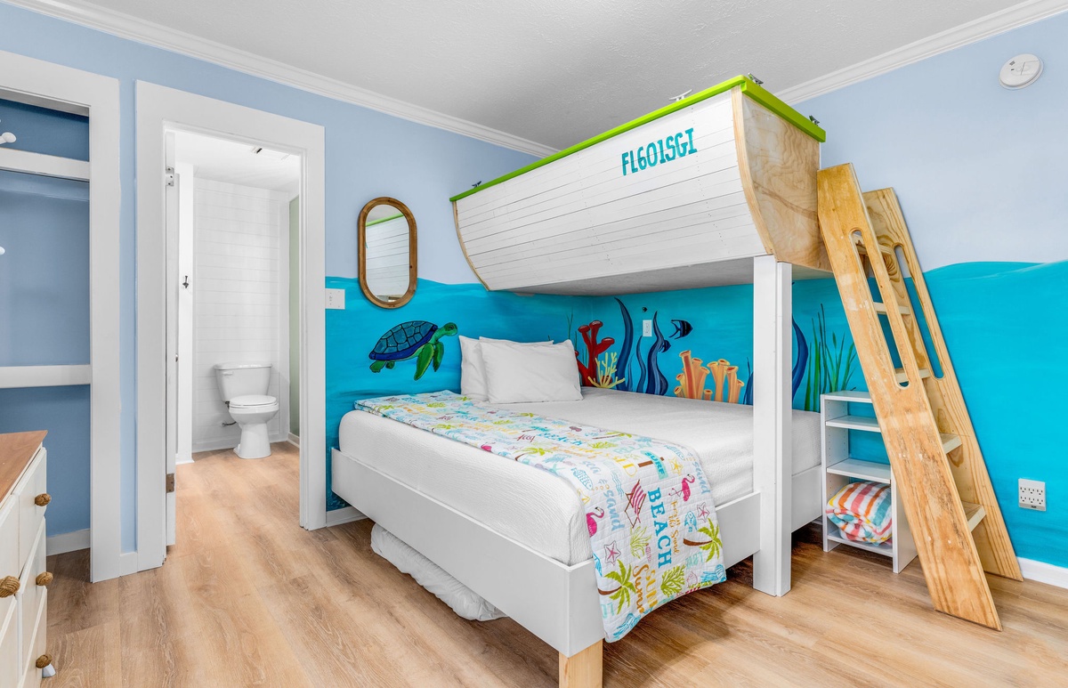 Step into your family's underwater adventure in this boat-themed bunk bed room, complete with ocean murals and nautical details.
