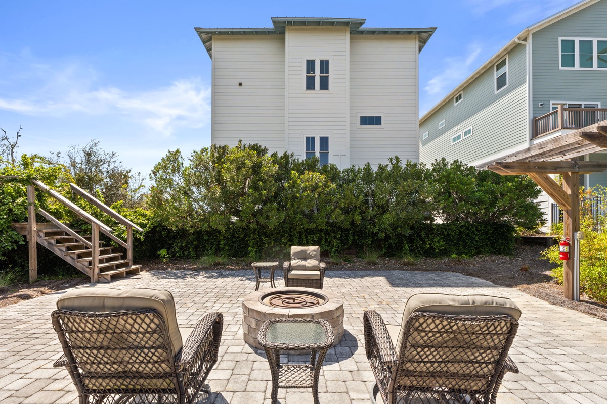 Gather around your private fire pit on this stunning patio, where comfortable seating awaits for memorable evenings under the stars.