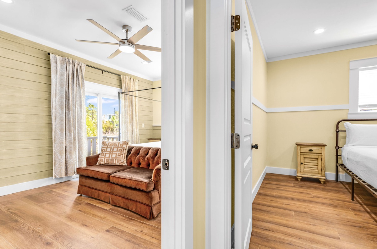 Step into your cozy suite where warm wood floors and soft lighting create the perfect retreat for relaxation.