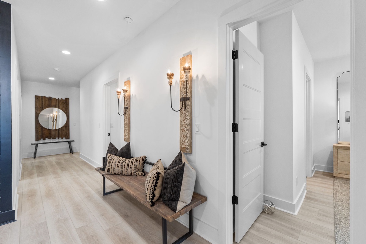 Step into your bright, thoughtfully designed entryway featuring warm wood tones, elegant lighting, and cozy seating that welcomes you home.
