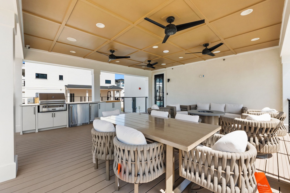 Gather with friends in this sophisticated rooftop terrace, where modern dining and full kitchen create your perfect outdoor entertaining space.