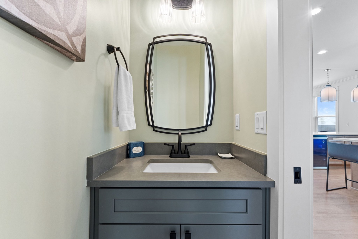Freshen up in your sleek, modern bathroom, where clean lines and stylish fixtures create a serene retreat after a day of adventure.