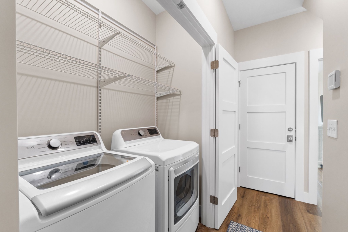 Your private laundry room makes extended stays effortless with full-size washer and dryer plus organized shelving for all your essentials.