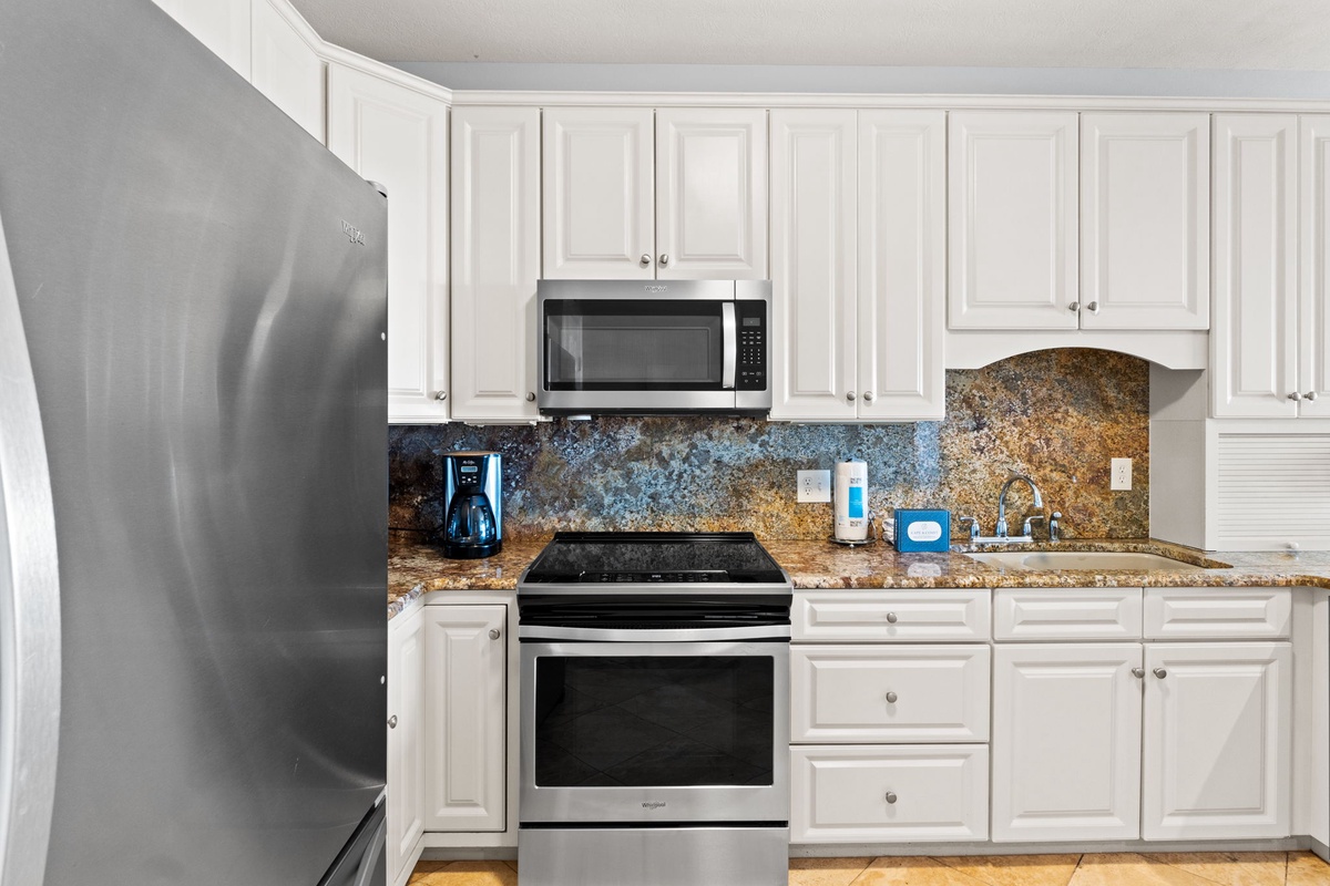 Your fully equipped kitchen features granite countertops, stainless steel appliances, and everything you need to prepare delicious meals during your stay.