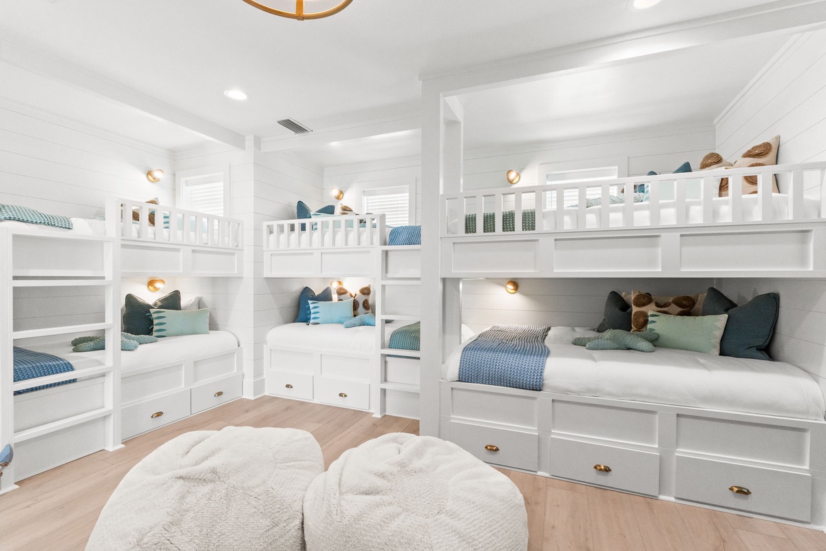 Your kids will love this magical bunk room with built-in beds, cozy reading lights, and plenty of storage for all their treasures.