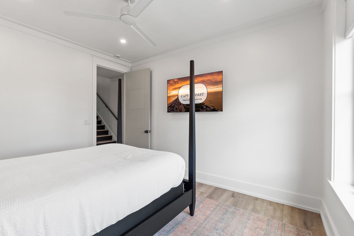 Unwind in your serene bedroom with crisp linens, modern furnishings, and peaceful ambiance for the perfect night's rest.