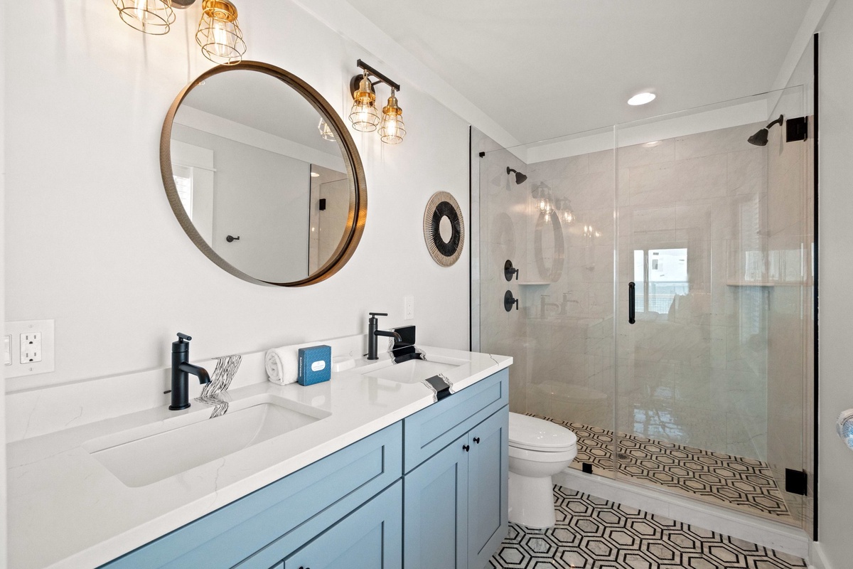 Unwind in your stylish bathroom featuring a spacious walk-in shower, modern fixtures, and elegant touches that create a spa-like retreat.