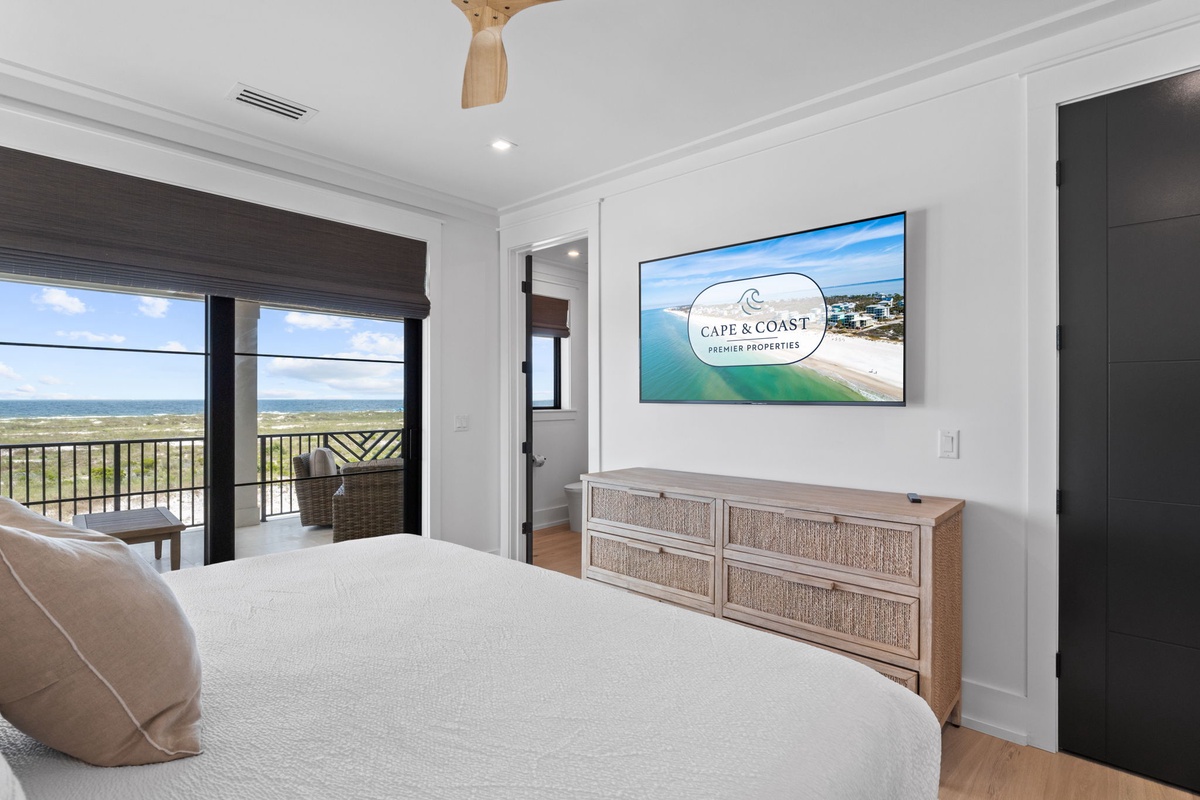 Wake up to stunning ocean views from your private balcony, unwind in coastal comfort with beach-inspired décor, and enjoy modern entertainment on the large-screen TV.