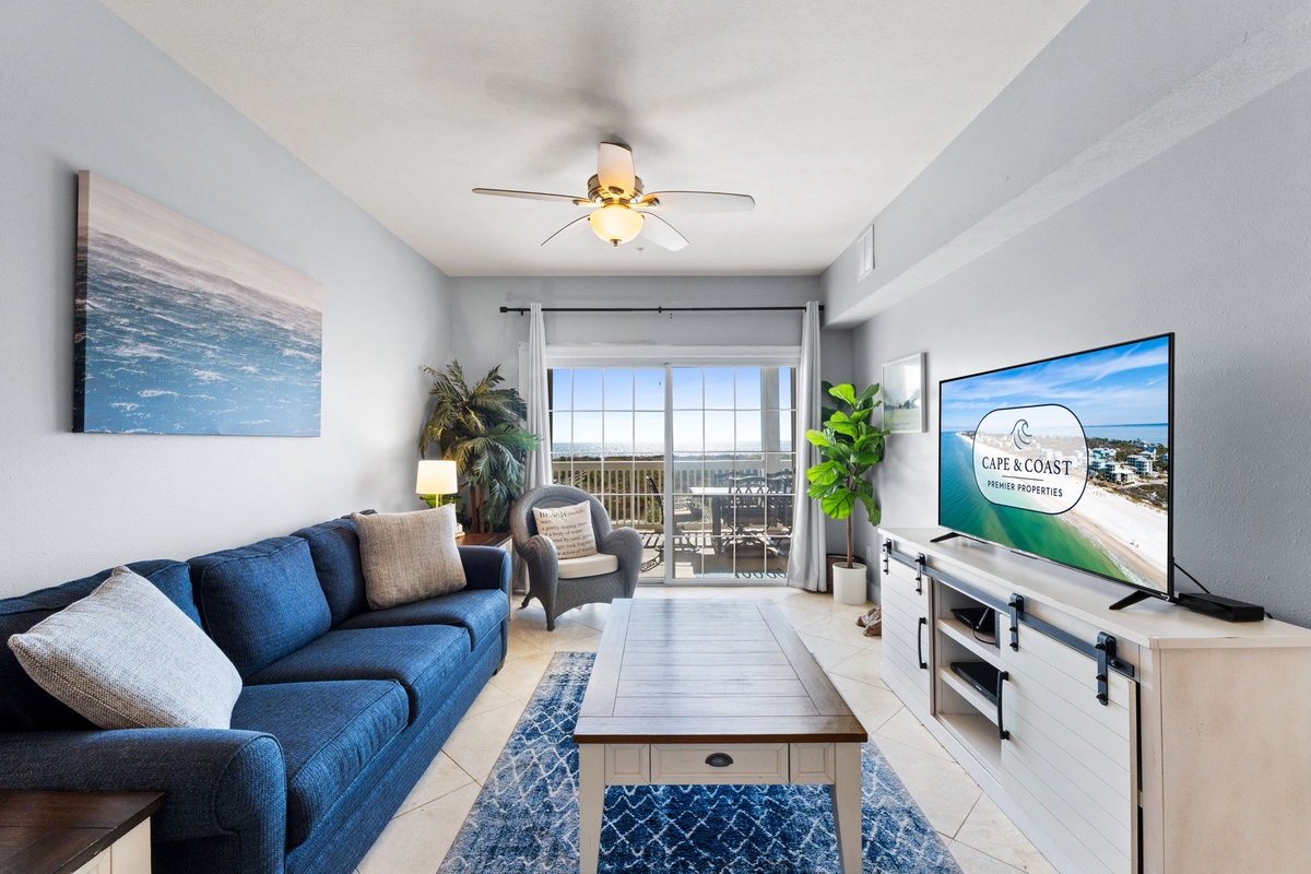 Unwind in your bright, coastal-themed living space with plush seating and modern amenities for the perfect beach getaway.