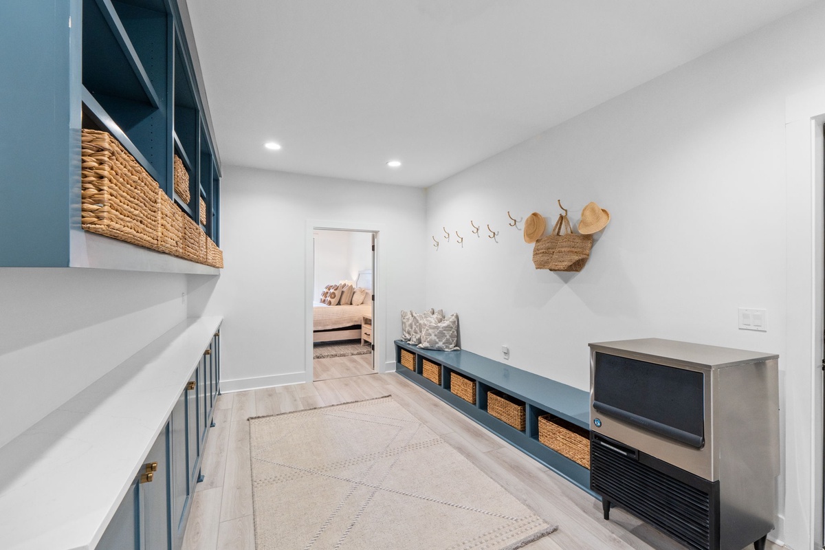 Discover your organized retreat with custom storage, woven baskets, and cozy seating - where every detail creates calm in your daily routine.