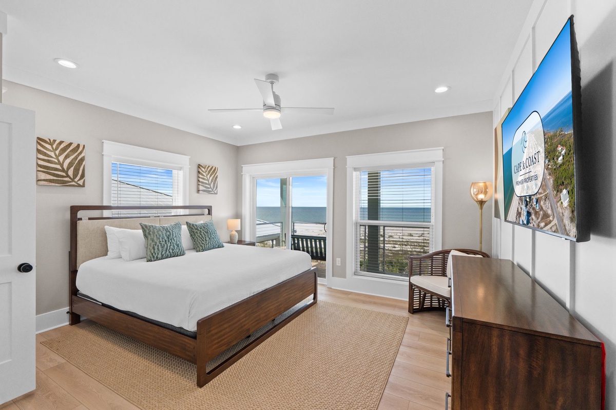 Your coastal bedroom opens to stunning ocean views through sliding glass doors. Sink into crisp linens as sea breezes drift in, and wake to the sound of waves just steps away.