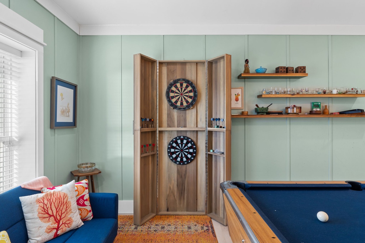Your game room awaits with pool table and dartboard for friendly competition after exploring the coast.