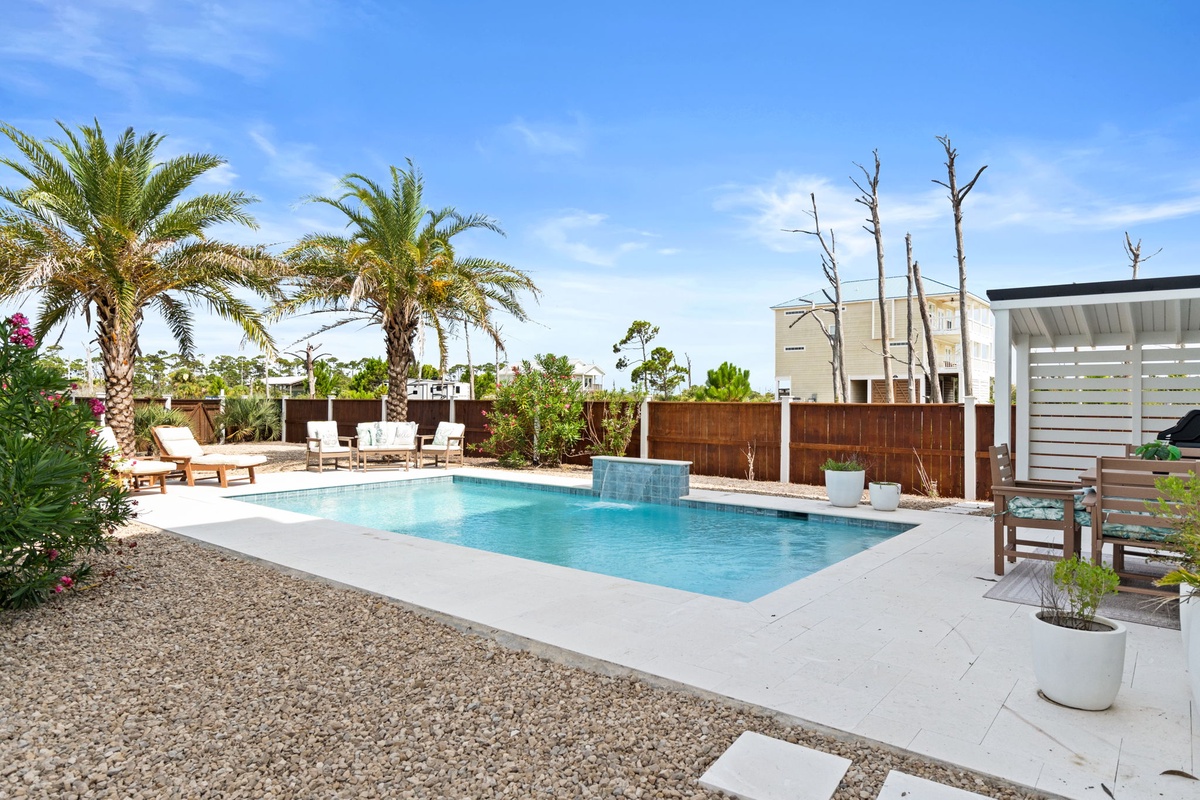 Dive into your private oasis, surrounded by swaying palms, modern water features, and sun-kissed lounge areas perfect for effortless outdoor living.