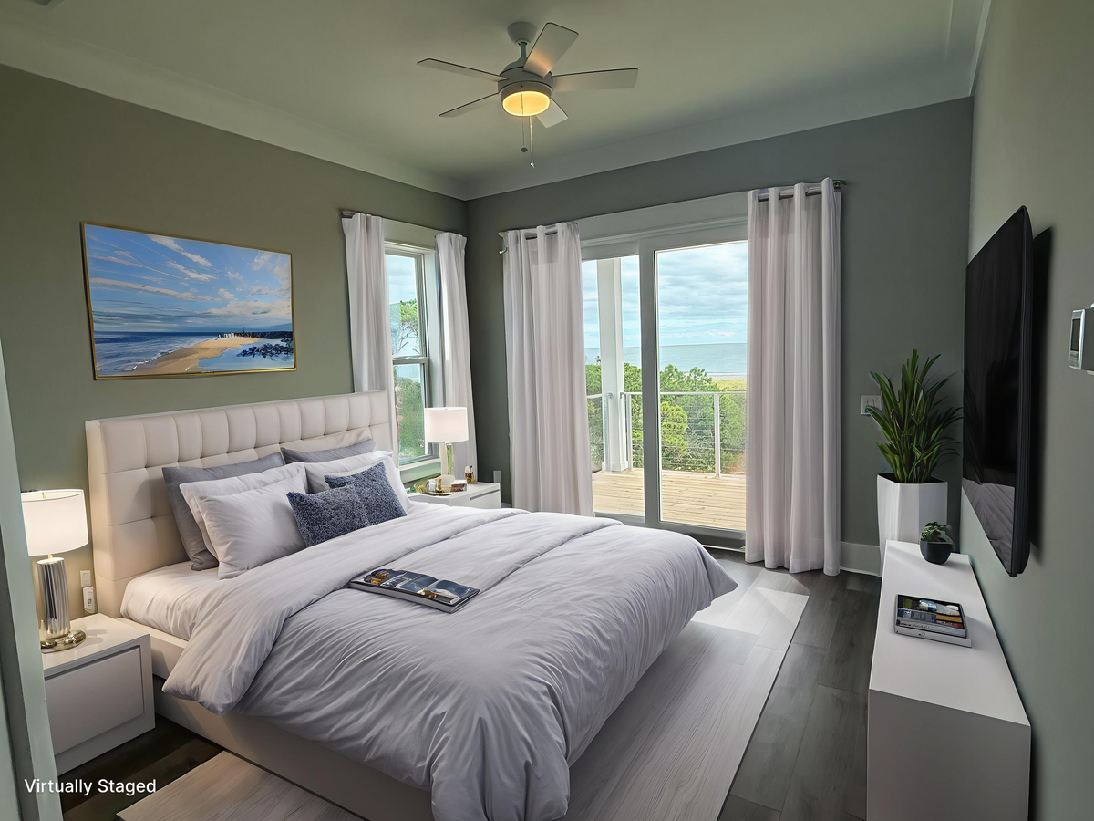 Drift off in your serene bedroom where ocean artwork meets modern comfort. Cool breezes from your ceiling fan create the perfect sleeping temperature.