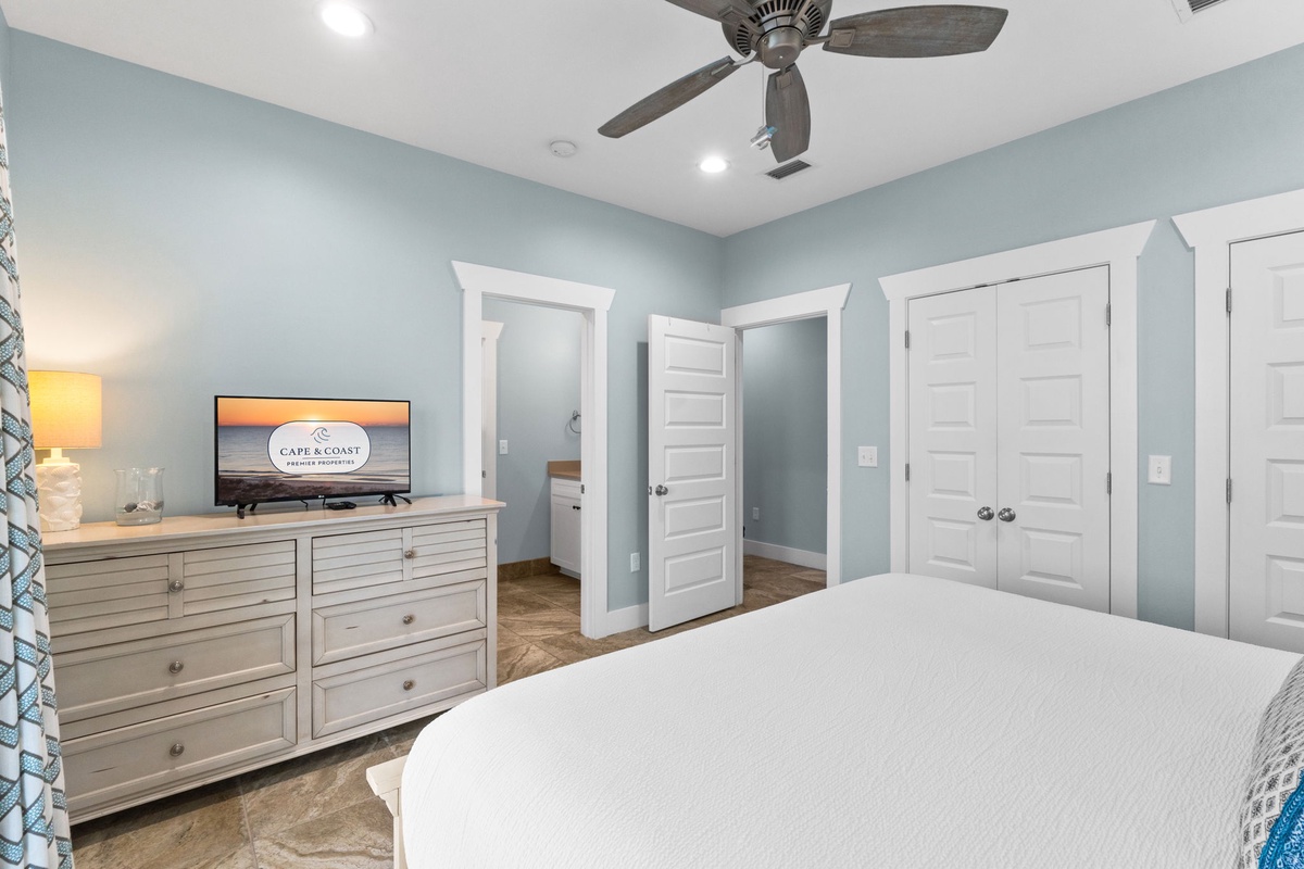 Your serene bedroom features calming coastal tones, a plush bed, and ample storage. Unwind with your favorite shows or step out to explore nearby spaces.
