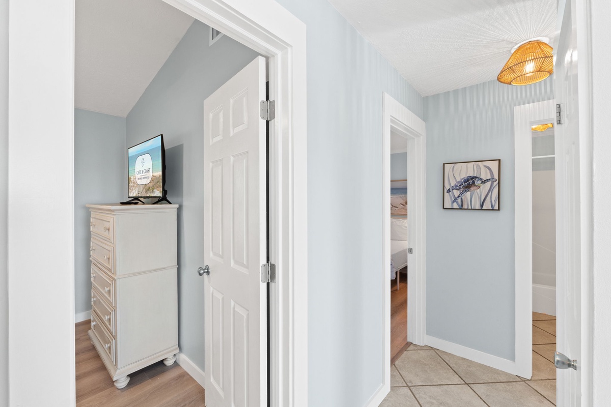 A clean, well-lit hallway provides easy access to bedrooms and bathrooms throughout the home.
