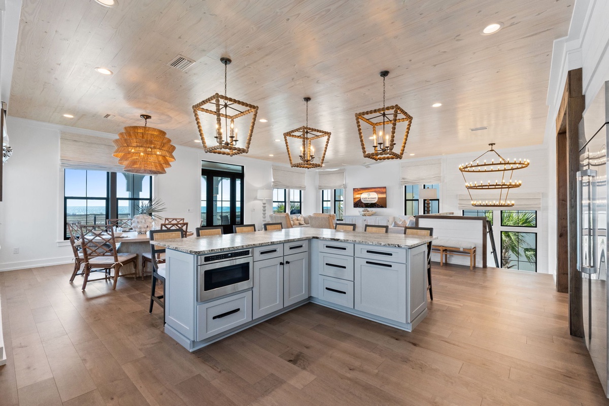 Your gourmet kitchen features stunning pendant lights and flows seamlessly into spacious living areas, perfect for entertaining.