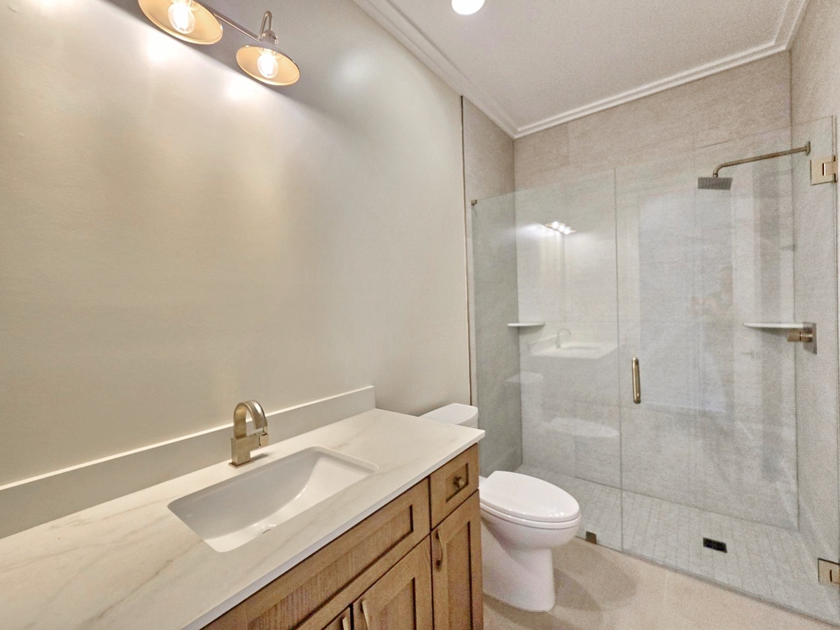 Step into your beautifully updated bathroom featuring gleaming fixtures and a luxurious walk-in shower for the perfect start to your day.