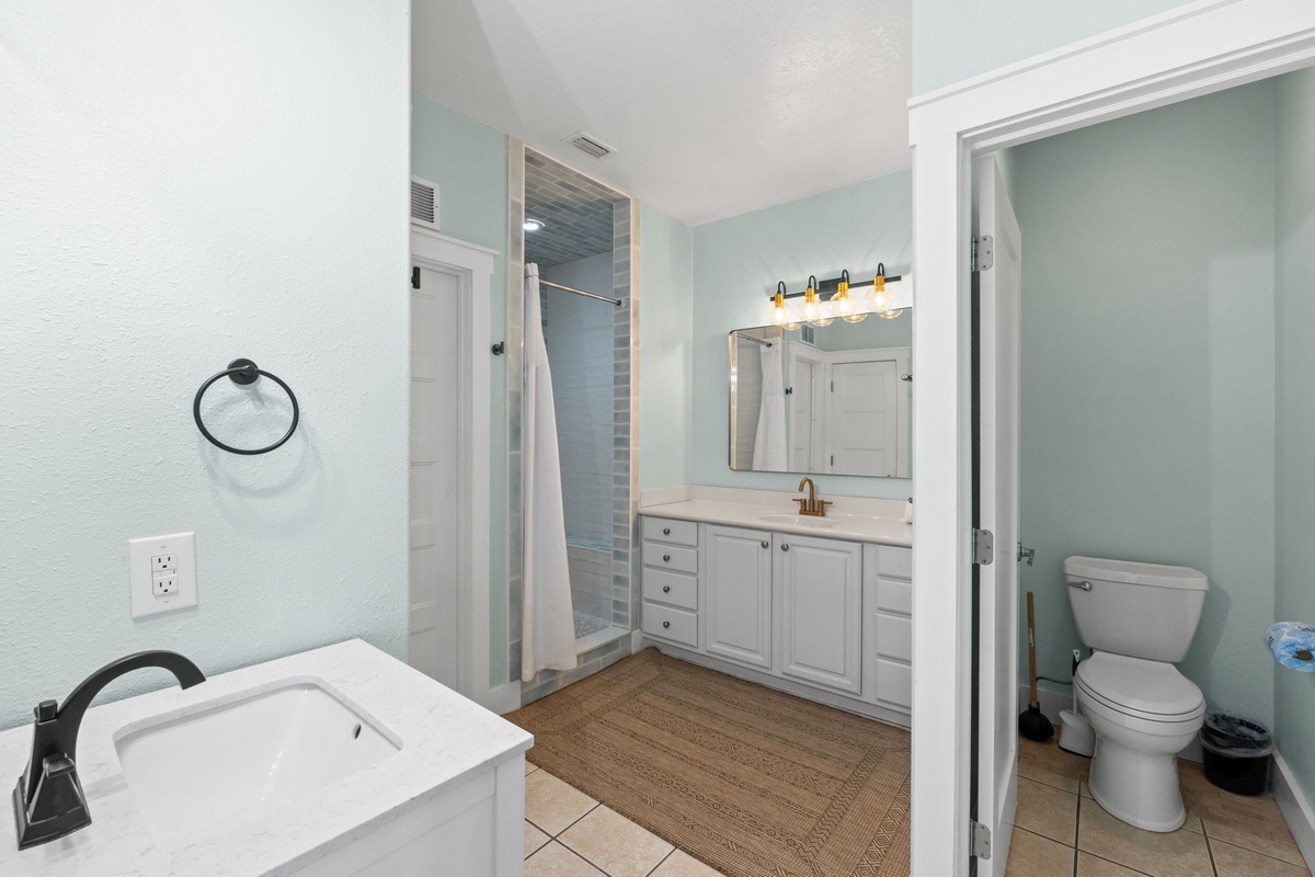 Refresh in your spacious bathroom with dual vanity, soaking tub, and walk-in shower—soft coastal tones create a calm, spa-like retreat for your stay.