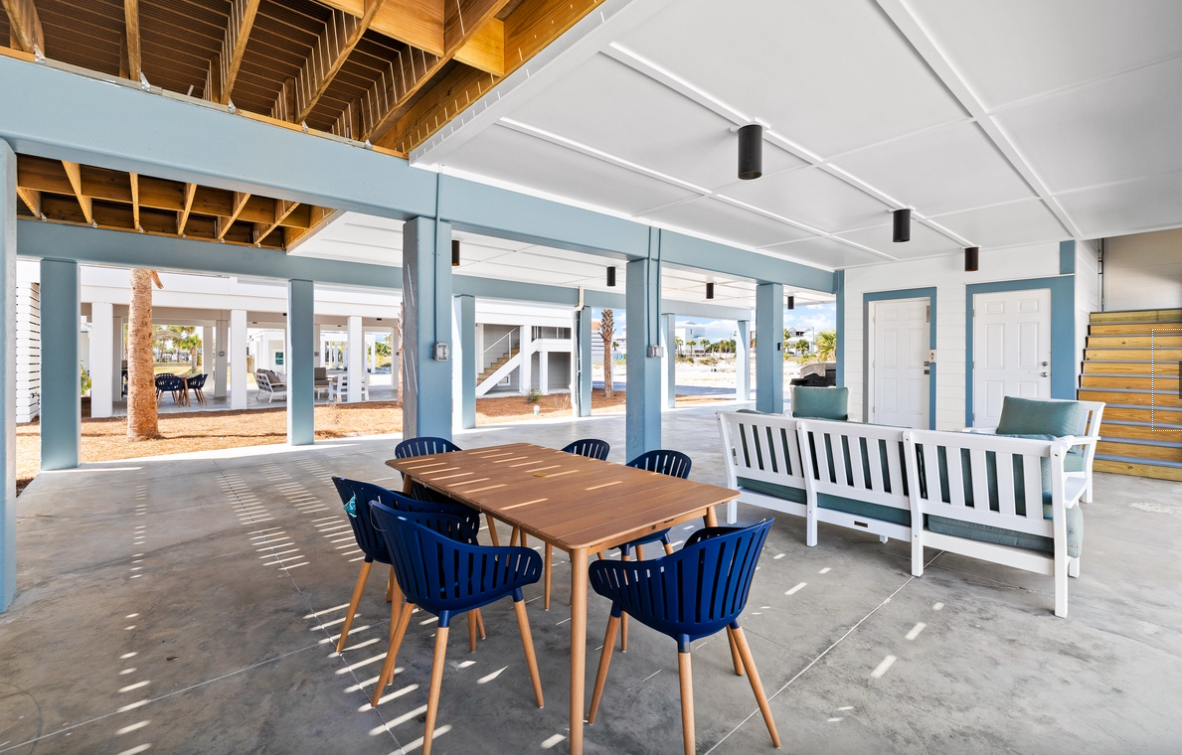 Relax in your spacious covered patio with modern dining for six and comfortable seating - perfect for meals with ocean breezes.