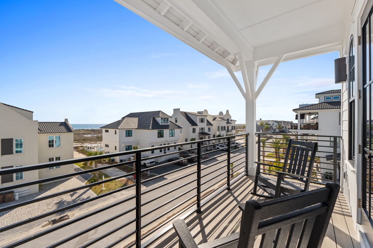 Relax on your covered balcony with ocean views, where morning coffee and evening sunsets become daily rituals in this peaceful coastal setting.
