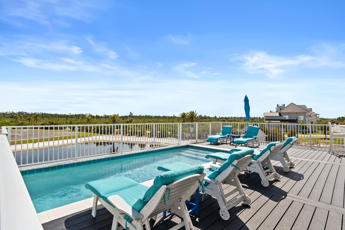 A private waterfront oasis awaits with expansive views of the canal and natural landscape. Soak up the Florida sunshine on cushioned loungers beside your pool.