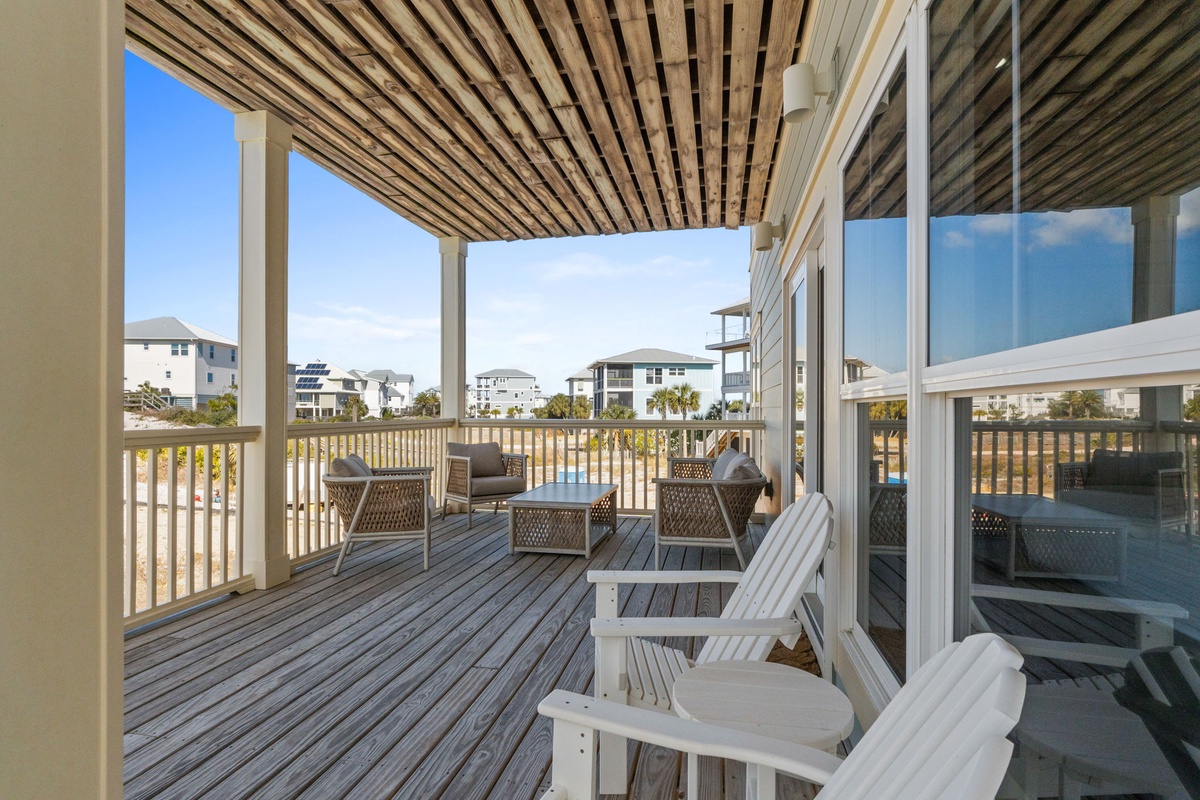 Unwind on your private deck with comfortable seating and coastal views, perfect for morning coffee or sunset relaxation.
