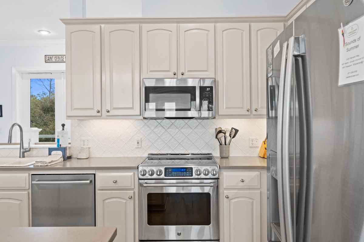 Your fully equipped kitchen awaits with stainless steel appliances, elegant cabinetry, and everything you need to create memorable meals during your stay.