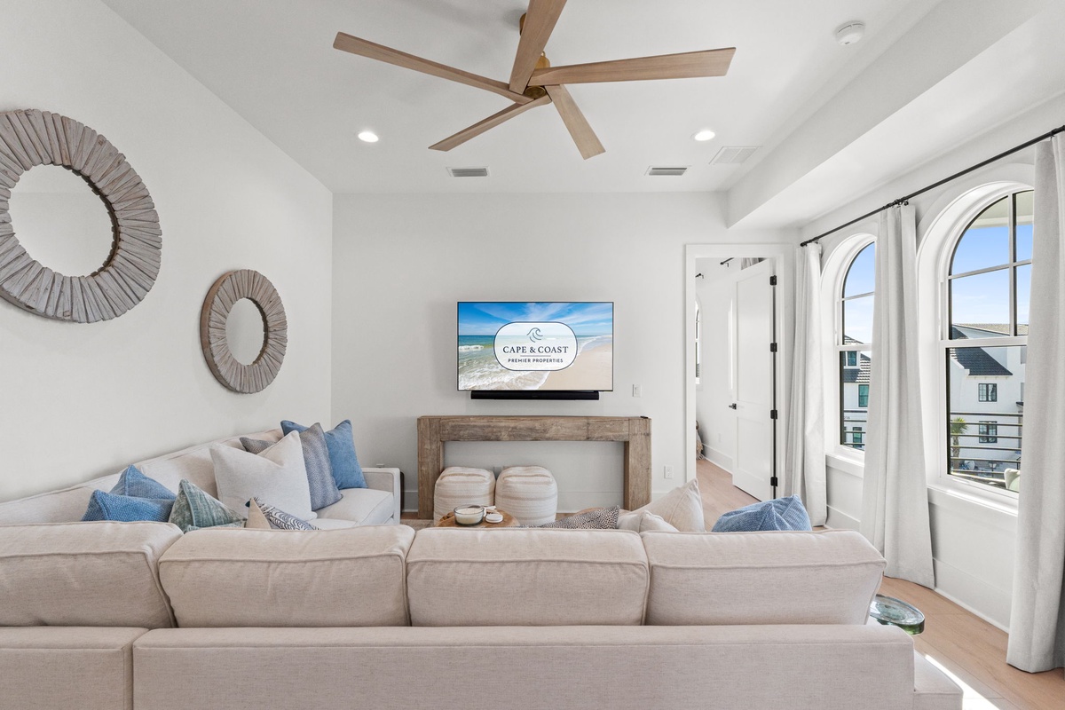 Sink into plush coastal comfort in your bright living room, where ocean-inspired blues and airy whites create the perfect retreat.