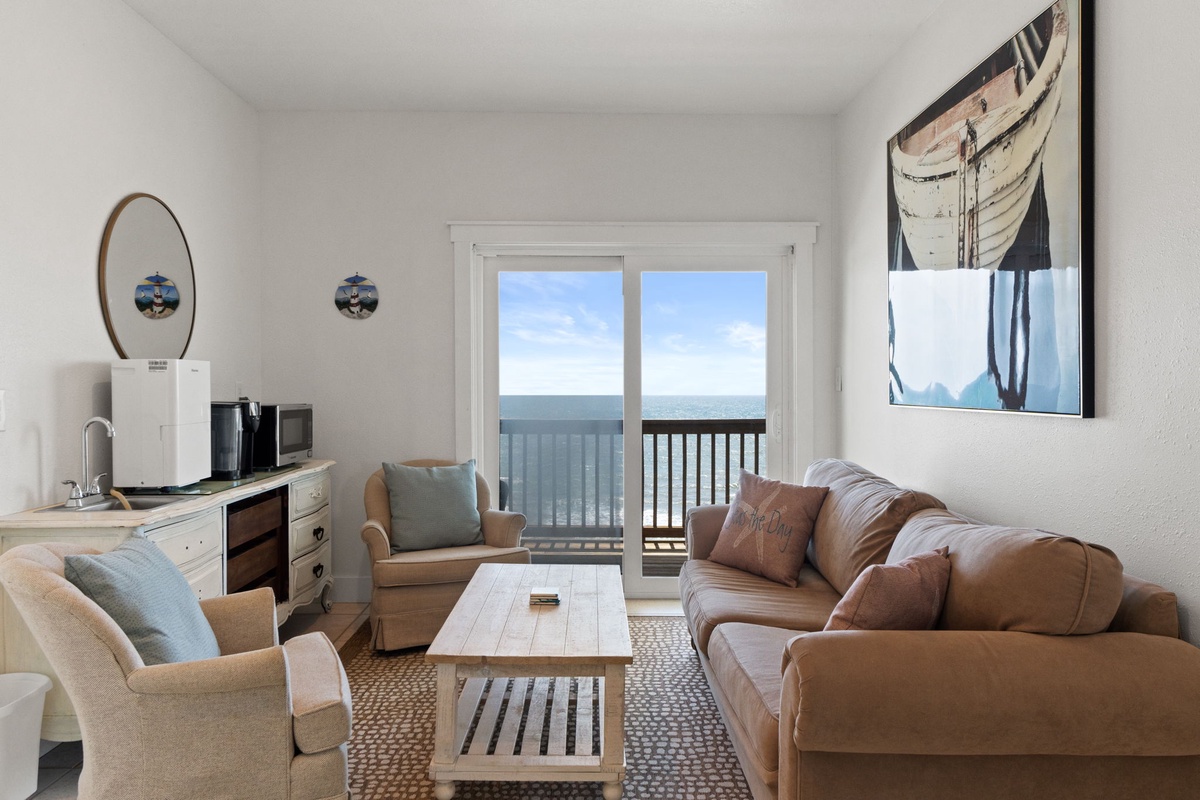 Relax in your coastal retreat with stunning ocean views from the private balcony. Sink into comfortable seating, sip coffee from your kitchenette, and let calming nautical artwork and sea breezes wash over you.