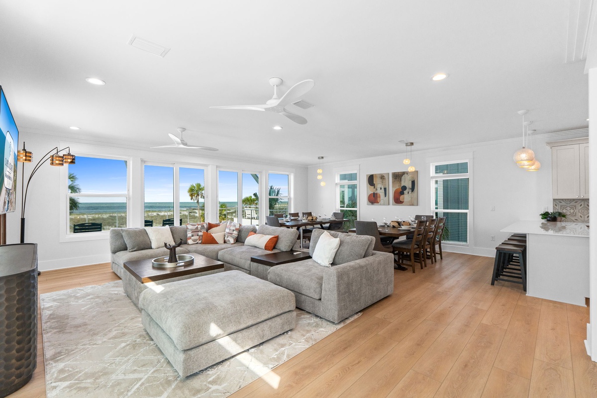 Relax in your open-concept living space, where panoramic windows frame stunning ocean views and fill the room with natural light and sea breezes.