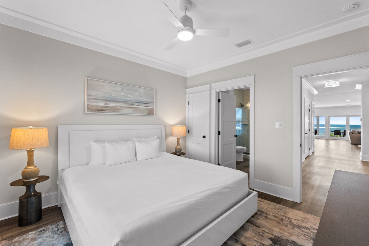 Sink into crisp linens and wake to soft coastal light streaming through your serene bedroom. Your private en-suite and stunning views await just steps away.