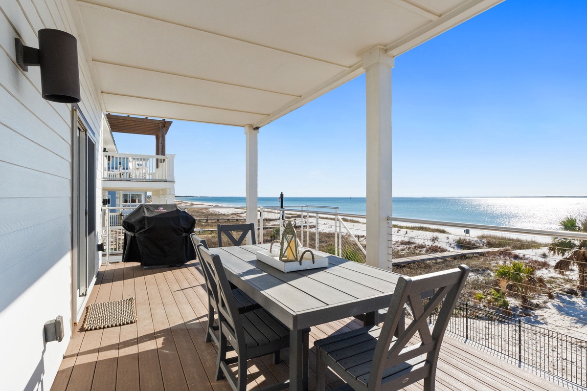 Your private covered deck offers stunning ocean views while you dine al fresco, with sparkling waters just steps away.