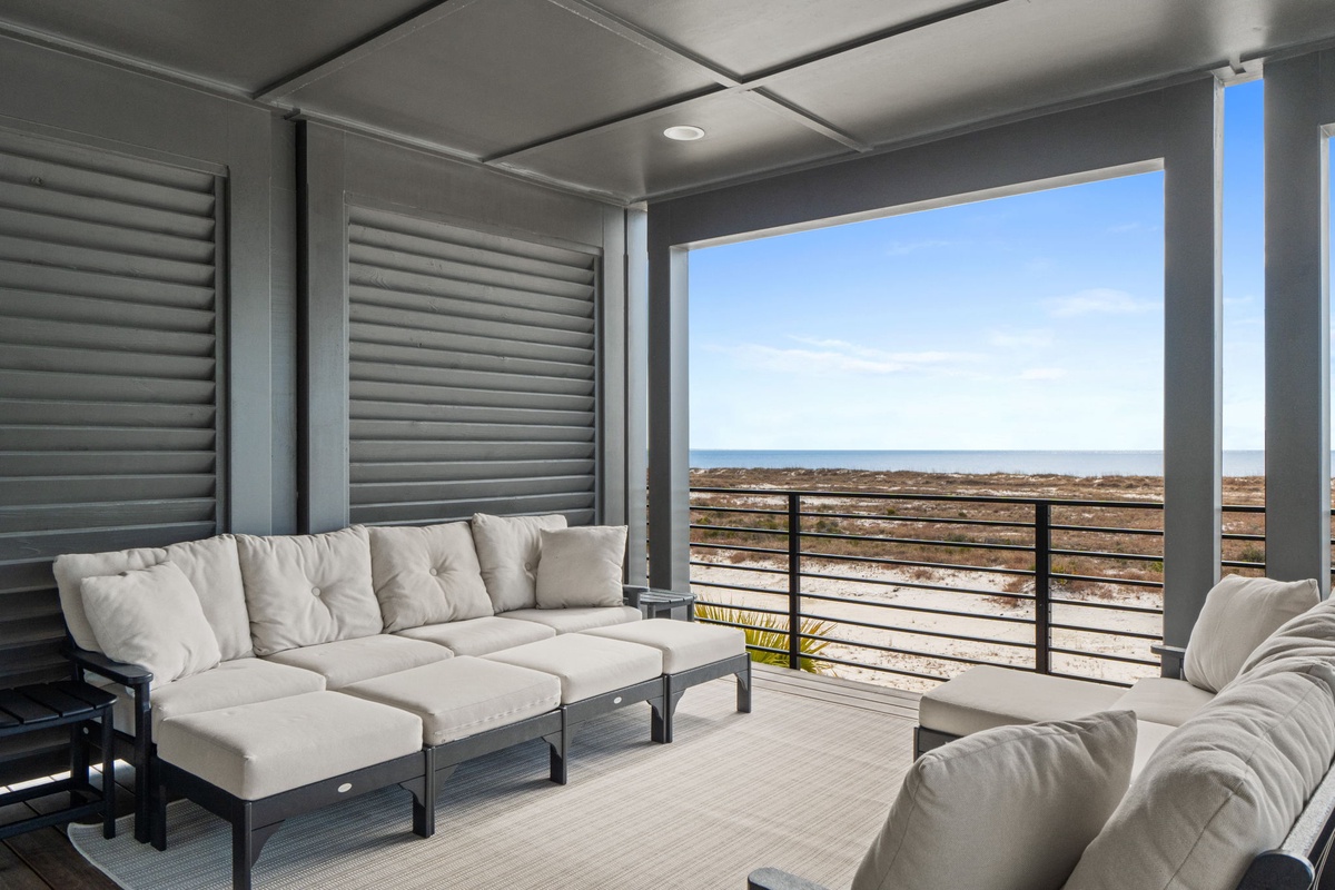 Unwind on your private covered terrace with plush seating while taking in sweeping ocean views that stretch to the horizon.
